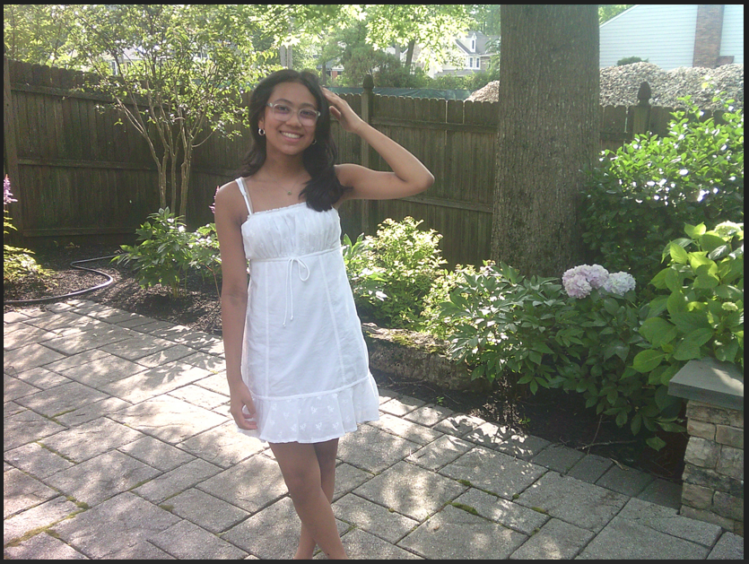 Norah smiling outside